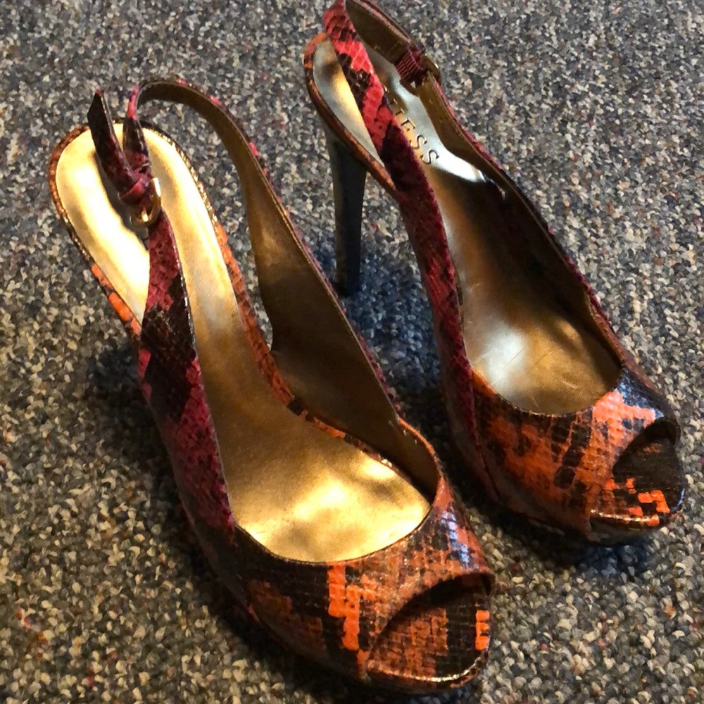 Multicolored snakeskin heels. Peep toe.
